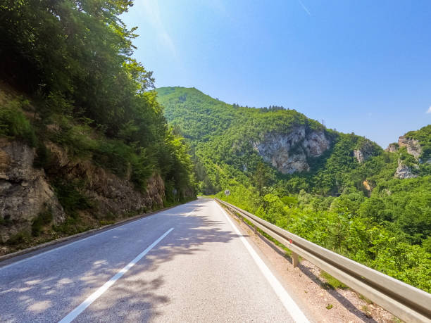 istock Mountain Road Surrounded By Lush Nature In Visegrad 1616988286