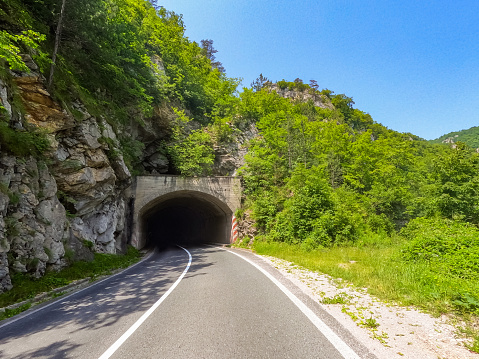Empty road leading to a tunnel in Visegrad, Bosnia and Herzegovina.