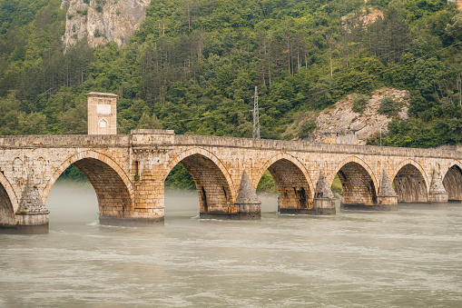 A view of Mehmed Pasa Sokolovic bridge (Na Drini cuprija) over river Drina in Visegrad, Bosnia and Herzegovina.