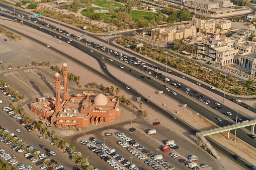 Aerial with of Kuwait City downtown with the Bader Al-Mailam Mosque and a large parking lot. Kuwait City. Kuwait.