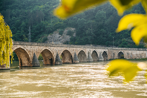 A view of Mehmed Pasa Sokolovic bridge (Na Drini cuprija) over river Drina in Visegrad, Bosnia and Herzegovina.
