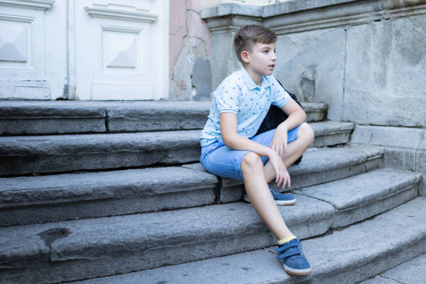 istock Back to school. Happy boy is walking with backpack. He is going to school after summer break. Schoolboy is ready for new schoolyear. 1617031325