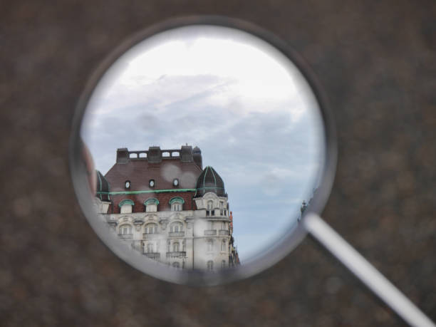 istock View of buildings seen through side mirror 1617040974