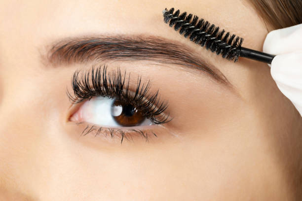 istock Face of young woman having a procedure performed on her eyebrow 1617061738