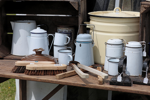 A display of vintage enamel kitchenalia. —- Second World War, Home Front, Home Guard and other 1940s paraphernalia all on display at Ashby Parva Vintage Revival - Ashby Parva, Leicestershire, 17th June 2023
