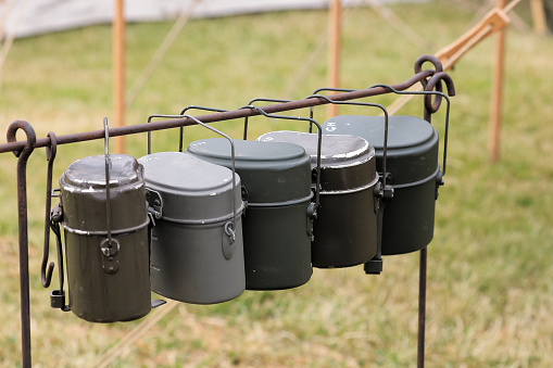 German Army canteens above a camp stove. —- Second World War, Home Front, Home Guard and other 1940s paraphernalia all on display at Ashby Parva Vintage Revival - Ashby Parva, Leicestershire, 17th June 2023