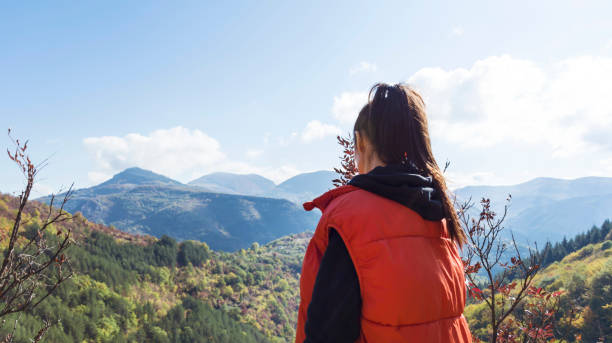 istock Woman standing in the mountain 1617070809