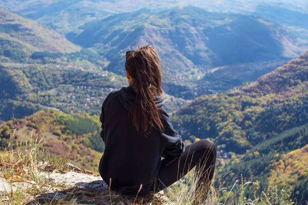 istock Woman standing in the mountain 1617076026