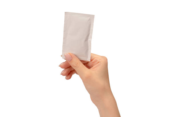 istock Wet wipe in a woman hand isolated on a white background. 1617082482
