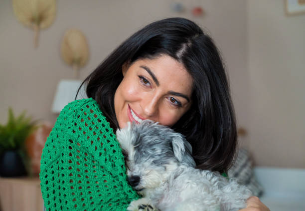 istock Woman Hugging her Havanese Dog at home 1617089032