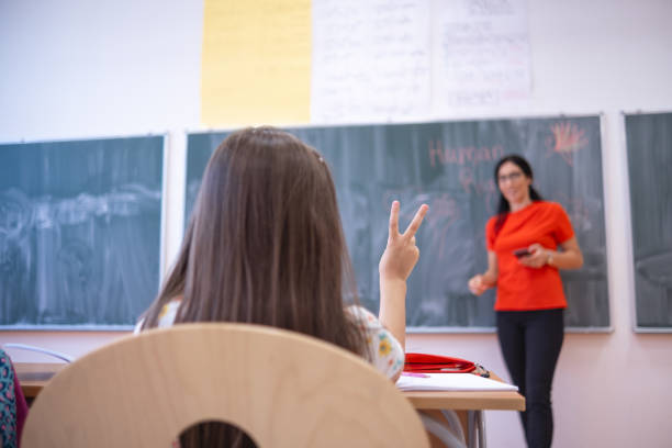 istock Asking for permission to answer at school 1617094498