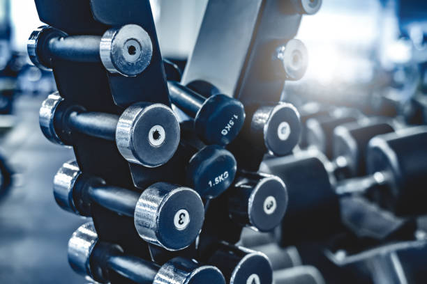 istock rows with a set of dumbbells 1617100864