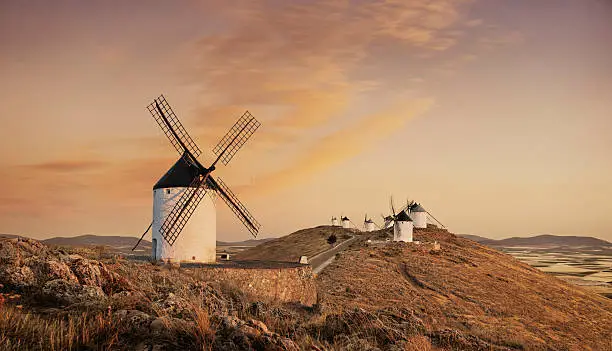 Windmills at sunset in Castilla La Mancha, Spain.