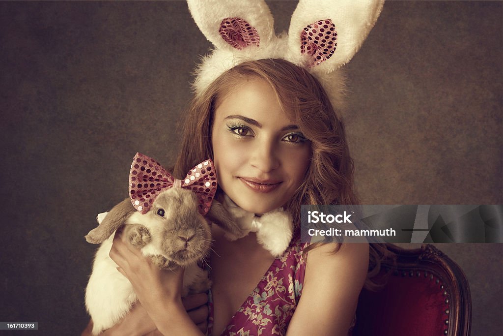 Playboy-bunny holding a rabbit - Lizenzfrei Frauen Stock-Foto