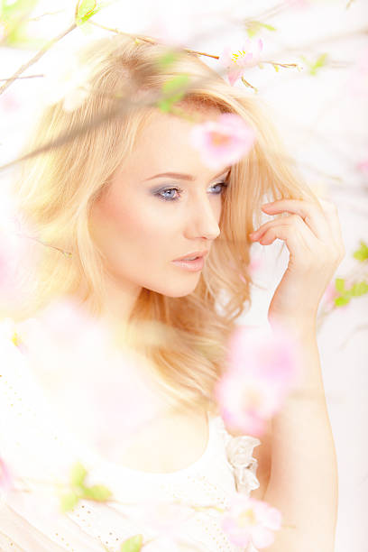 istock beautiful woman with spring flowers 161711904