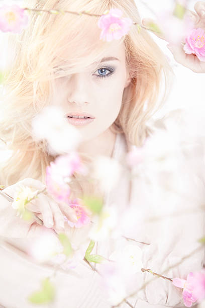 istock beautiful woman with spring flowers 161712114