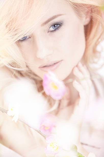 istock beautiful woman with spring flowers 161712118