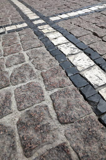 Modern backyard details combining artificial grass, gravel and paving slabs