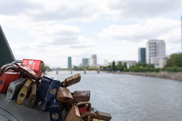 Love locks hang on the fence of a pedestrian bridge in the German city of Frankfurt am Main.