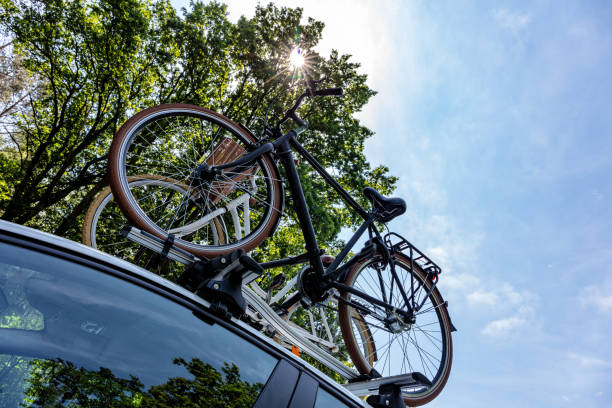 istock bicycle rack on top of white car 1617133089