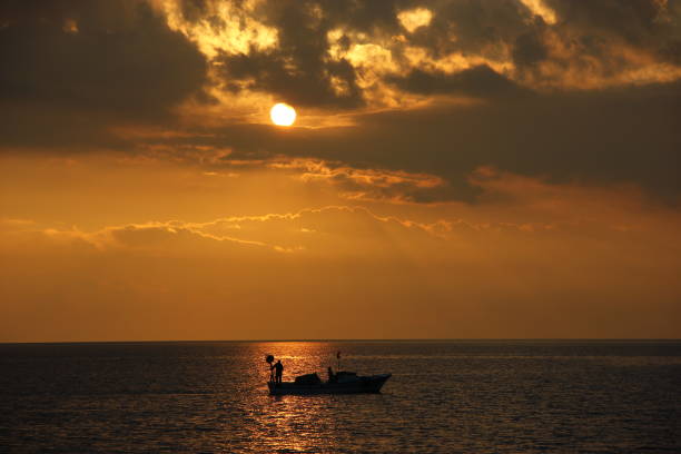 Free picture: Silhouette of small fishing boat on the water backlighted ...