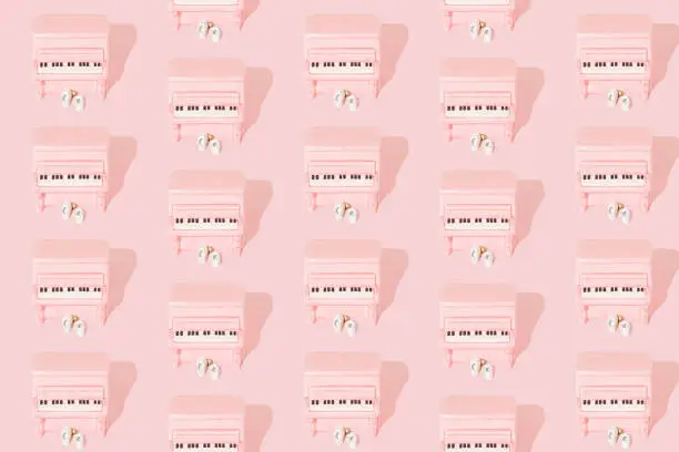 Photo of Minimal music art concept with pink piano.