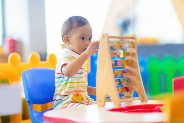 istock Cute baby boy in kindergarten or daycare. 1617154162
