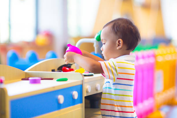 istock Cute baby boy in kindergarten or daycare. 1617161902
