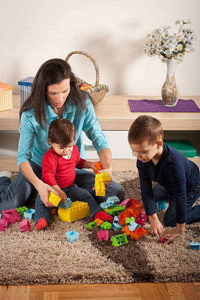 istock Kids play with mother 161716963