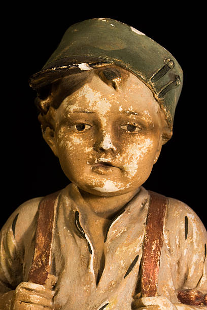 istock Gypsum statue of boy with cap 161717330
