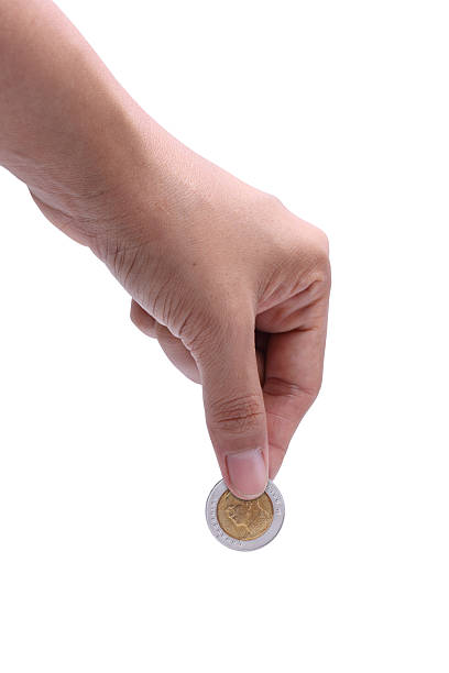 istock Woman hand with coins. 161717380