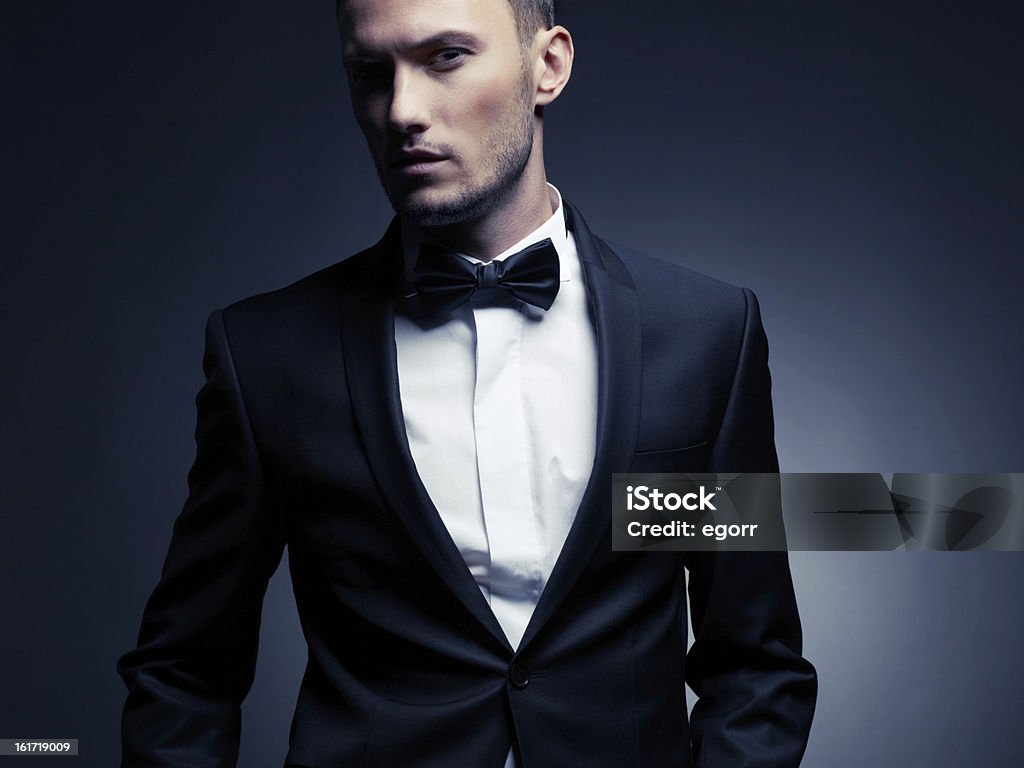 Handsome stylish man Portrait of handsome stylish man in elegant black suit Men Stock Photo