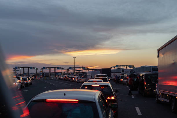 Line of cars stopped at customs control and state border.