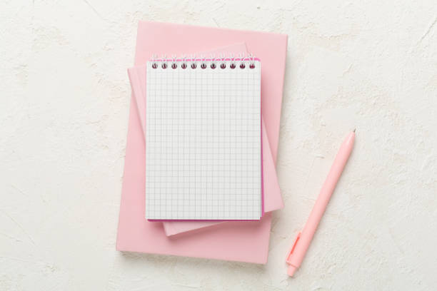 istock Notebooks with stationery on concrete background, top view 1617225254