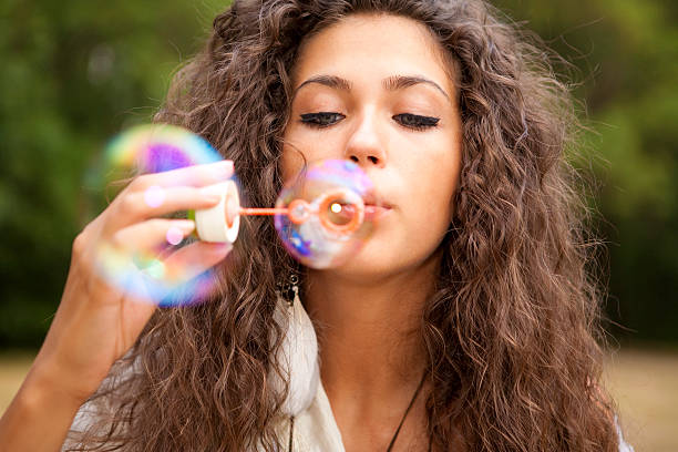 istock Girl and soap bubbles 161722529