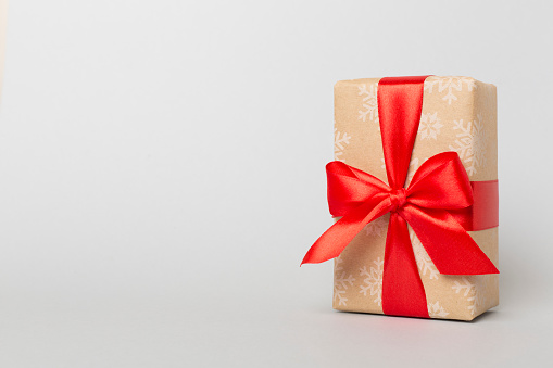 Gift box on color background.