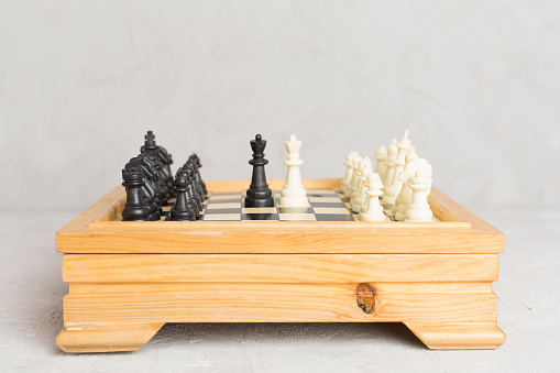 Wooden chess on concrete table