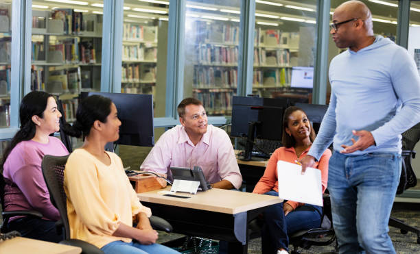 istock Adult students, teacher in continuing education class 1617246256