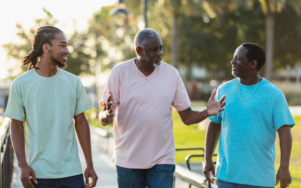 istock Multi-generation African-American family walking, talking 1617249018
