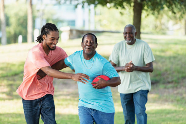 istock Multi-generation family having fun with football 1617250541