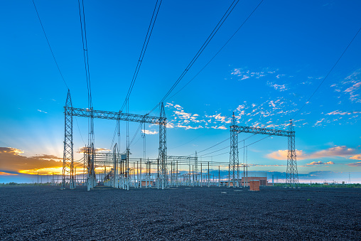 Electric substation and pwer lines in Paraguay at sunrise