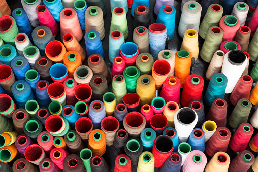 Colorful sewing threads at a weaving workshop
