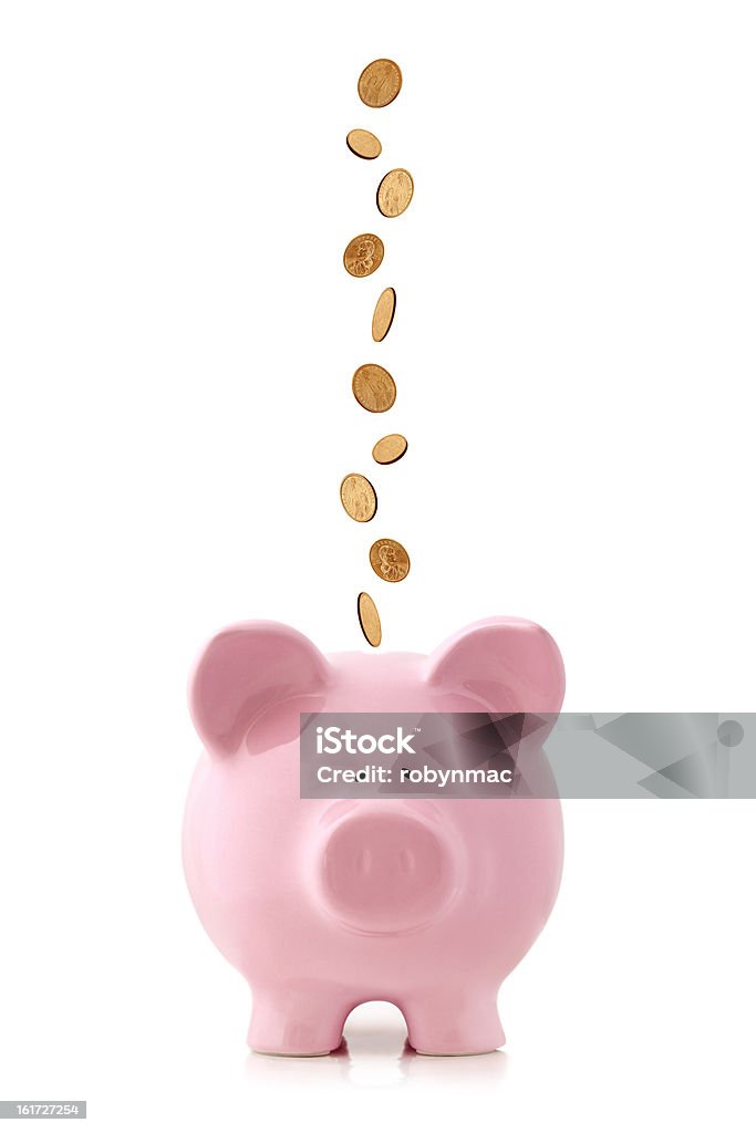 Piggy Bank with Falling Coins Golden coins falling into a pink piggy bank, isolated on white.  US dollar coins Piggy Bank Stock Photo