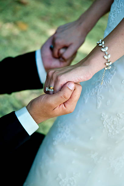 istock Wedding couple holding hands 161727346