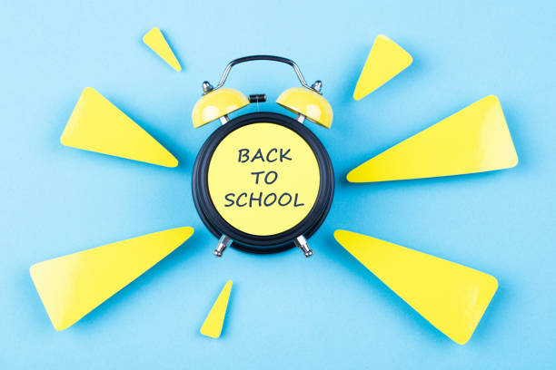 zurück to school - back to school equipment capital letter clock stock-fotos und bilder