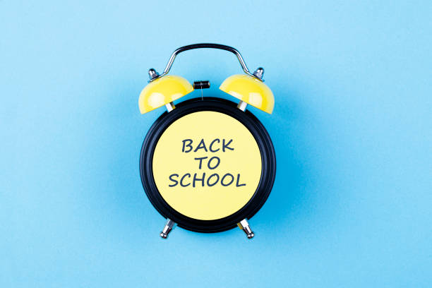 zurück to school - back to school equipment capital letter clock stock-fotos und bilder