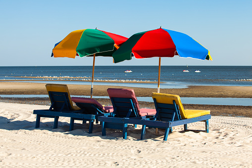 Gulf coast beach in Biloxi, Mississippi with recliner lounge chairs