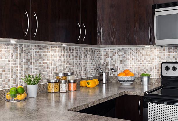 Modern kitchen with cozy lighting Modern kitchen with cozy lighting, and food ingredients on the counter top. streaky lights stock pictures, royalty-free photos & images