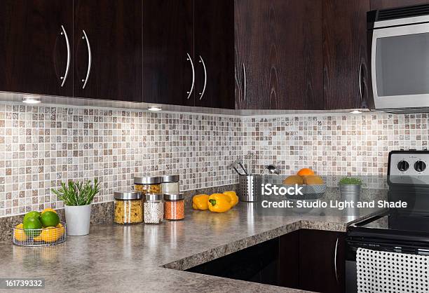 Modern Kitchen With Cozy Lighting Stock Photo - Download Image Now - Kitchen, Tile, Cabinet