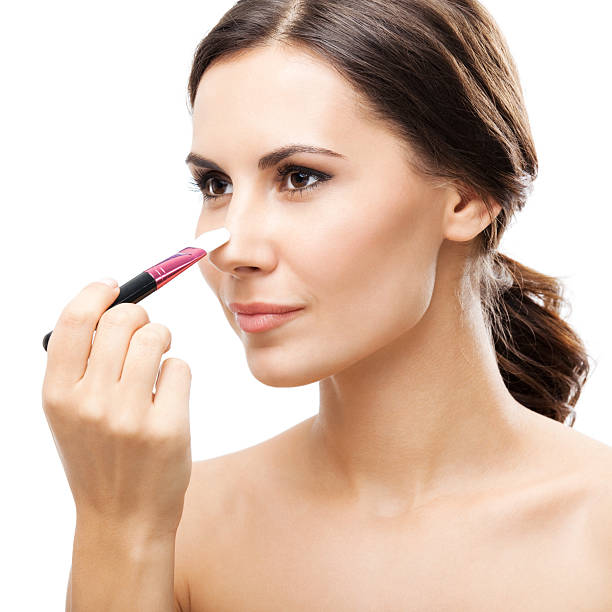 istock Smiling woman with make up brush, isolated 161740854